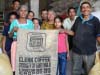 Members of Apecaform proudly display their first export sacks carrying the Small-Producer Symbol (SPP).