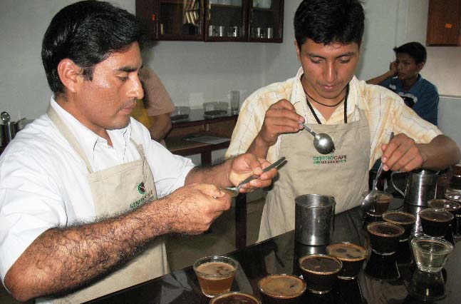 Quality Controller, Alexander Rangel, tests and scores each batch of coffee brought to CENFROCAFE by their members.