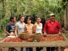 Guillermo Sanchez and his family show the results of their harvest. Due to roya impact and fluctuating prices they will be getting by with less this year.
